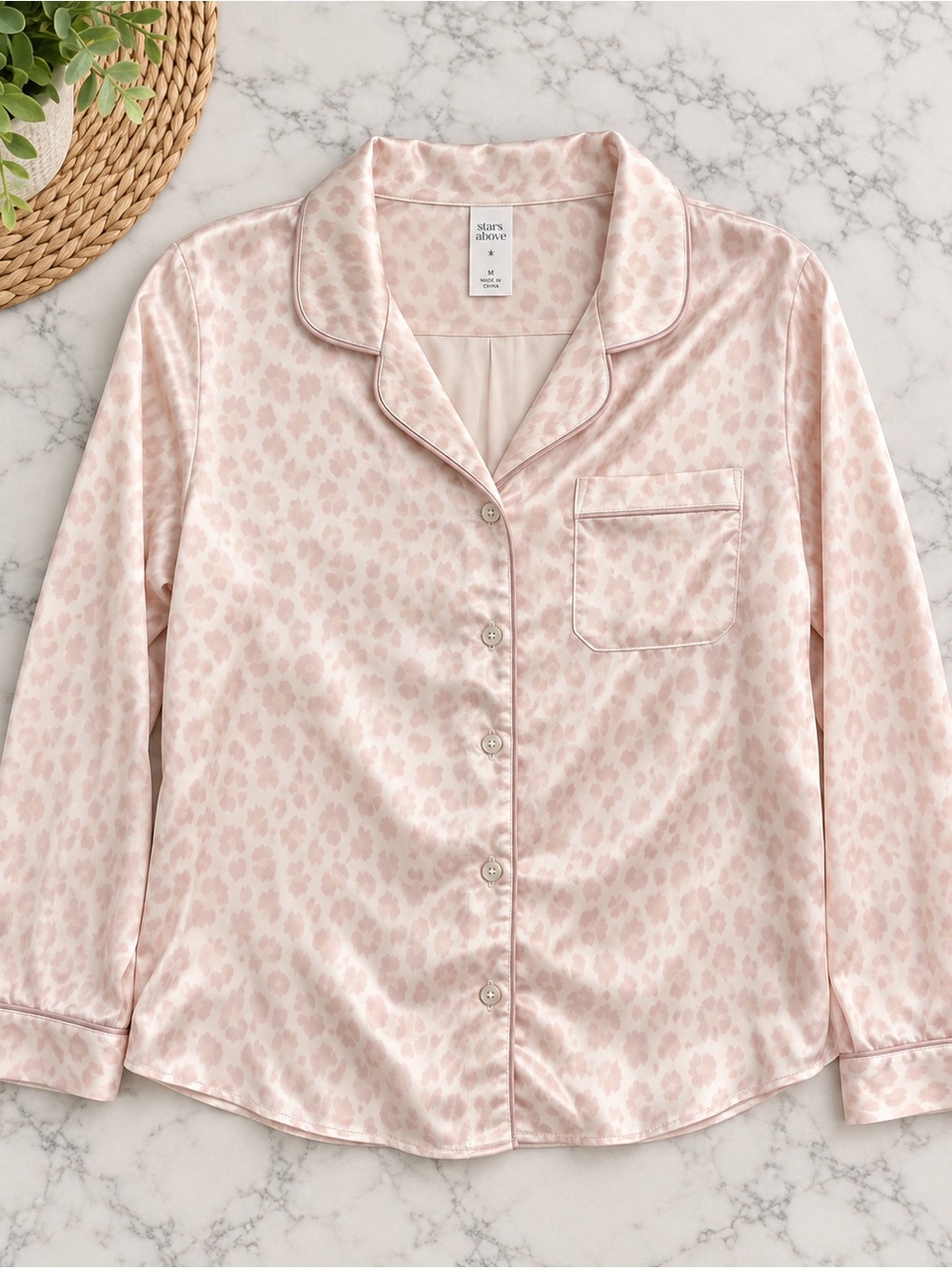 Stars above light pink cheetah print pajama top k